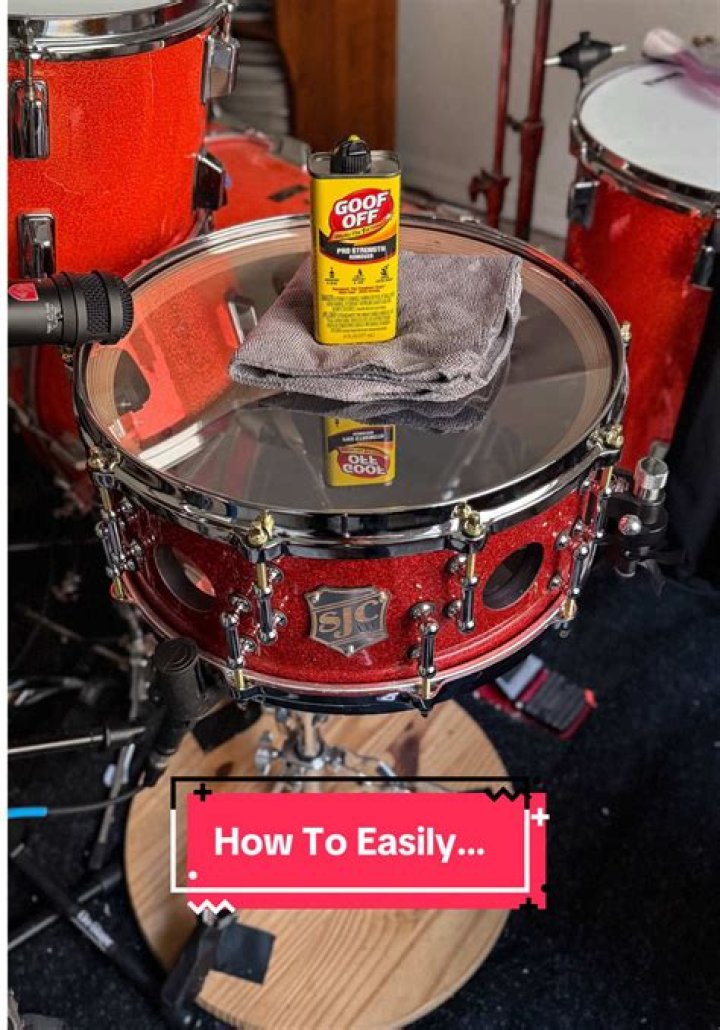 How do you remove logos from drum heads?