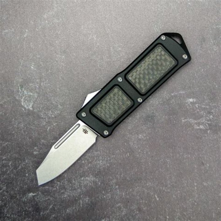 What is a double action OTF knife?